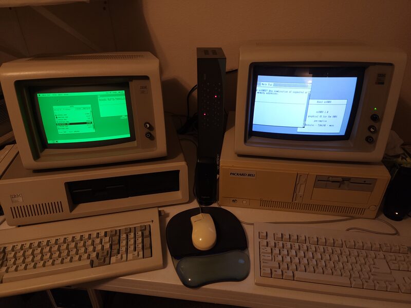 Two period PC monitors side by side, a green monochrome one and a colour one, both showing parts of the same os8088 desktop.