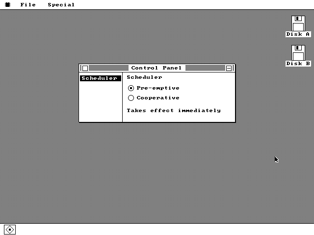 A Control Panel window split into two panes by a vertical rule. The left pane lists one item, Scheduler, drawn white on a black bar. The right pane is headed Scheduler and has two radio buttons, Pre-emptive selected and Cooperative empty, above the caption Takes effect immediately.