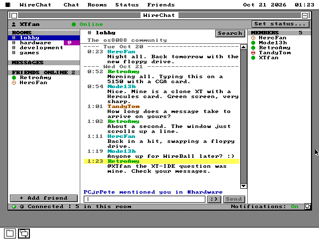 The lobby. The newest message, from RetroAmy, begins @XTfan and its header line is yellow. On the left the hardware room carries a magenta badge with @ in it, and the notice line above the input field reads PCjrPete mentioned you in #hardware.
